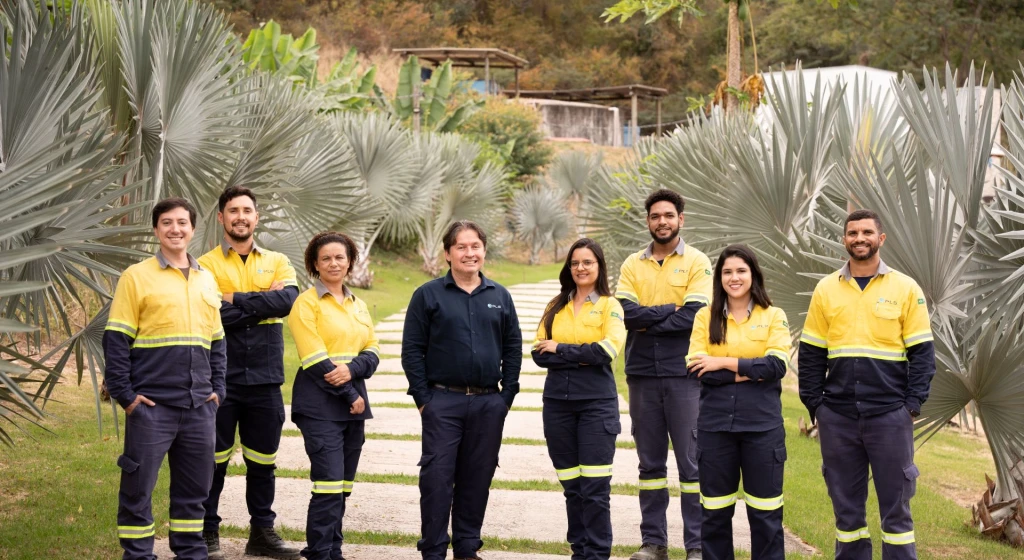 Group of PLS Brasil employees standing on a path